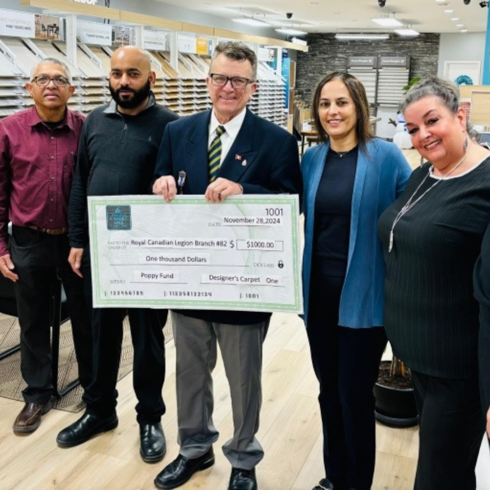 Designers Carpet One staff donating to the Royal Canadian Legion