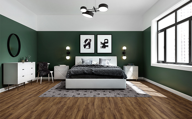 grey patterned area rug in bedroom with hardwood floors